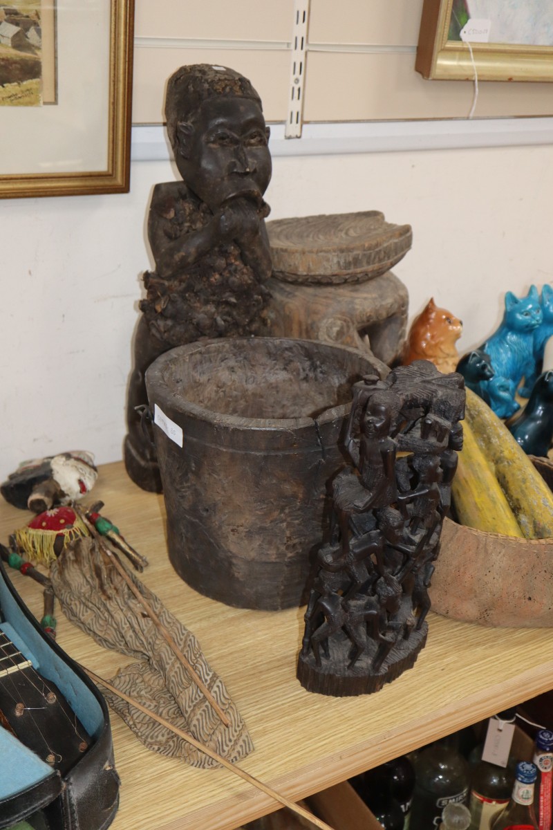 A collection of tribal carvings, stool etc